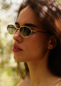 Komono TYLA Sunglasses — model wearing gold sunglasses — MYFASHIONFRUIT
