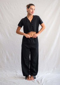 Woman wearing black Yin Pants and cropped top with button detail — MYFASHIONFRUIT