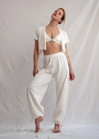 Woman wearing white Yang Pants and matching top — MYFASHIONFRUIT