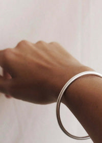 Kay Bracelet — Silver cuff on tan skin — MYFASHIONFRUIT