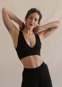 Woman wearing a soft black bralette with V neck and matching trousers — MYFASHIONFRUIT