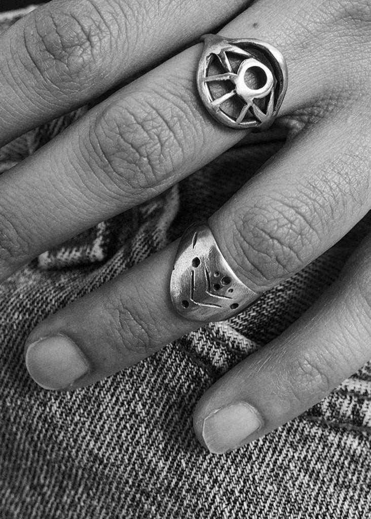 Evil Eye Ring — detail of textured silver rings on hand — MYFASHIONFRUIT