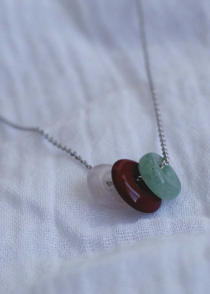 Love Creation & Heal Pendant — Detail of rings on silver chain — MYFASHIONFRUIT