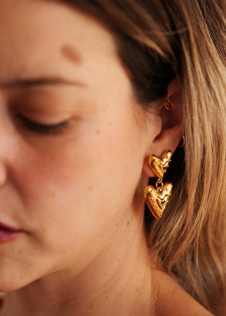 Amora Earrings — Gold heart earrings on model — MYFASHIONFRUIT