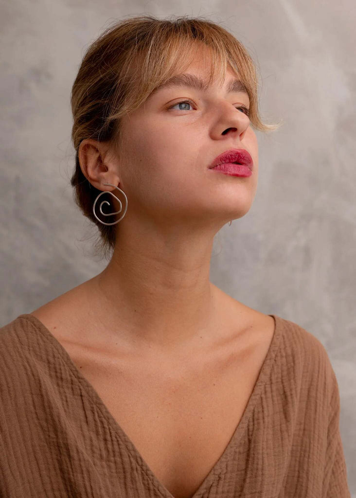Atalanta Earrings — Silver spiral earrings on model — MYFASHIONFRUIT