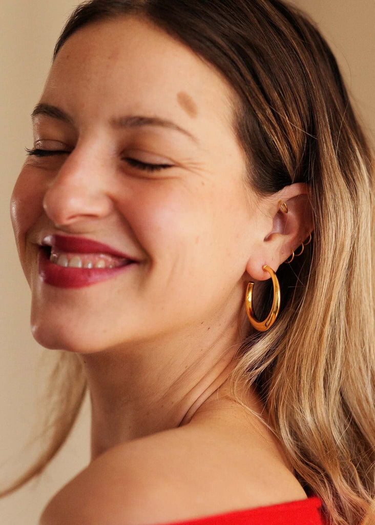 Cay Hoops — Gold hoop earrings on model — MYFASHIONFRUIT