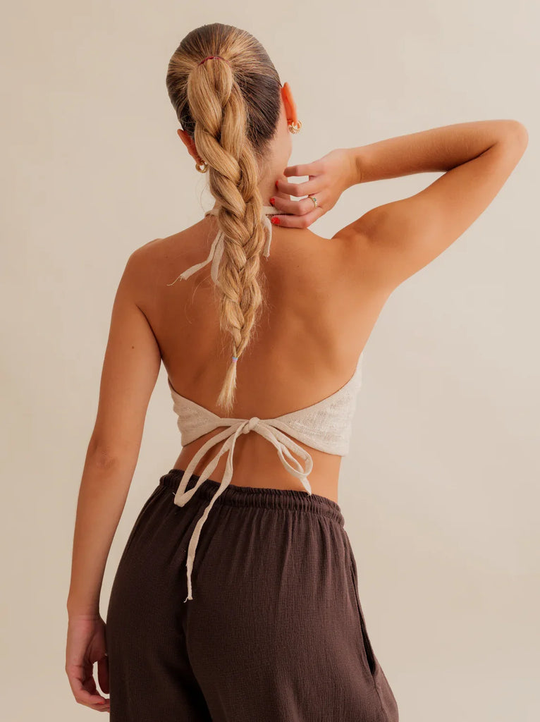 Aura Top — Back view, beige halter top, brown pants, on model — MYFASHIONFRUIT
