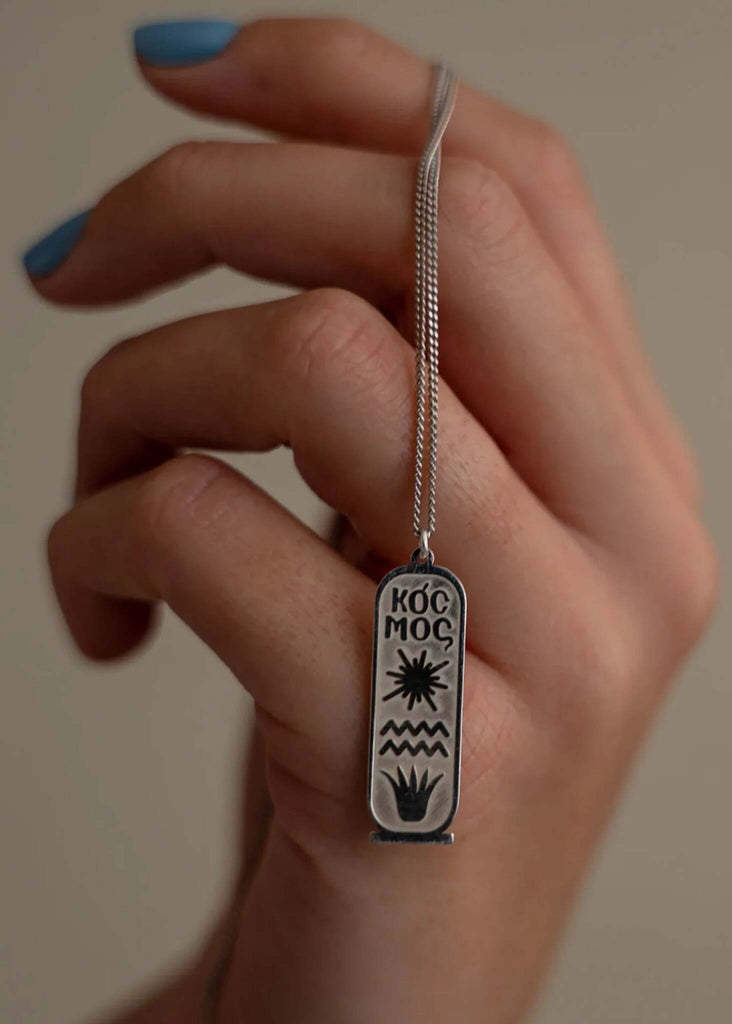 KOCMOS Talisman — Silver necklace detail in hand — MYFASHIONFRUIT