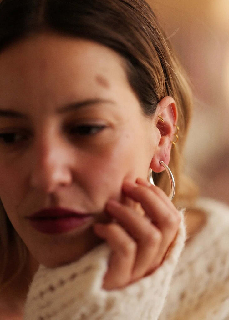 Cay Hoops — Silver hoop earrings on model, detail — MYFASHIONFRUIT