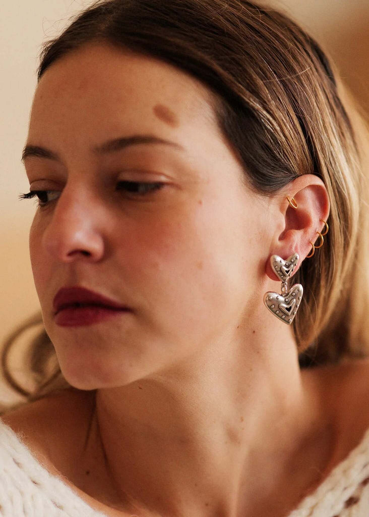 Amora Earrings — Silver heart earrings on model — MYFASHIONFRUIT