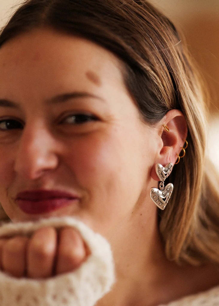 Amora Earrings — Silver double heart earrings on model — MYFASHIONFRUIT