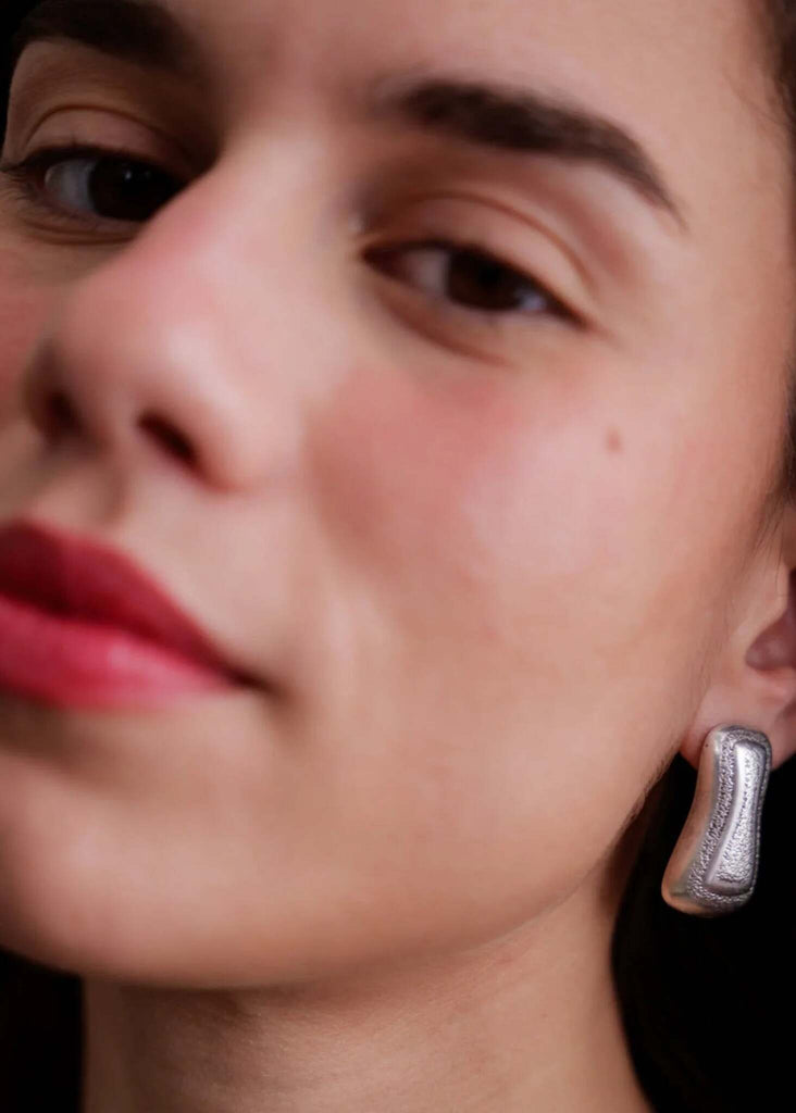 Minerva Earrings — Silver textured earring on model — MYFASHIONFRUIT