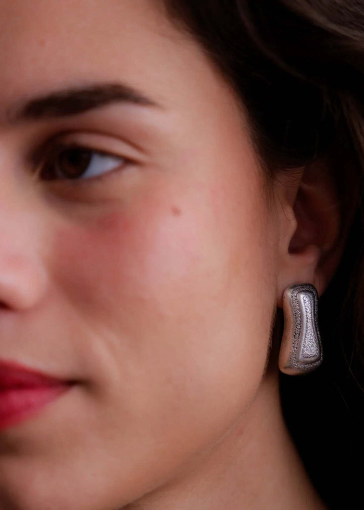 Minerva Earrings — silver textured stud on model — MYFASHIONFRUIT