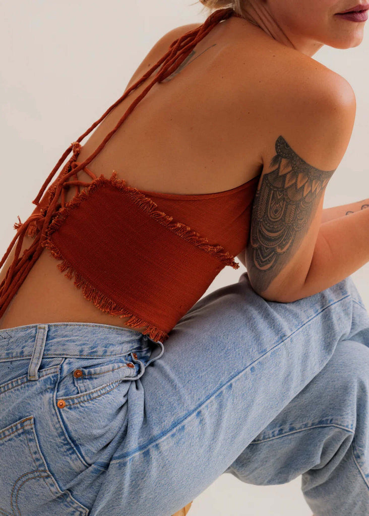 Amaya Top — Rust halter top with fringe detail on model — MYFASHIONFRUIT
