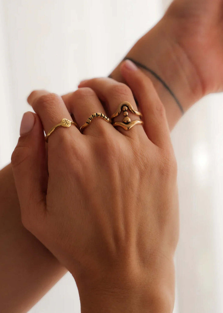 Solar Ring — Gold rings on hand, detail — MYFASHIONFRUIT