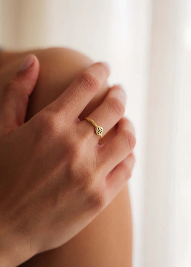 Stellar Ring — Gold ring with starburst detail on model — MYFASHIONFRUIT