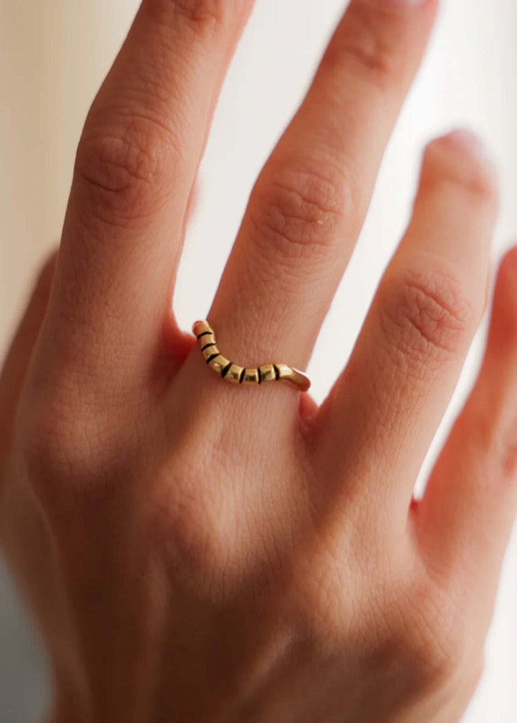 Solar Ring — Gold ring on finger, detail — MYFASHIONFRUIT