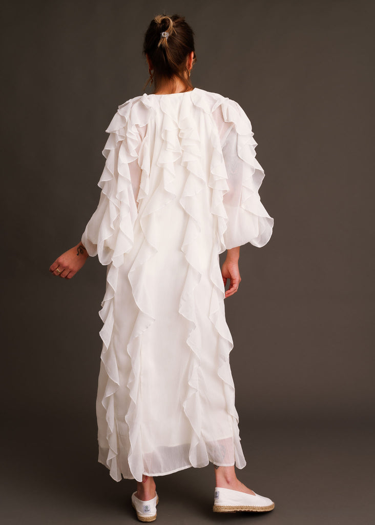Ysé Dress — White ruffled dress on model, rear view — MYFASHIONFRUIT