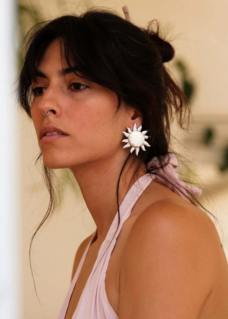 Olena Earrings — Sun-shaped silver earrings on model — MYFASHIONFRUIT