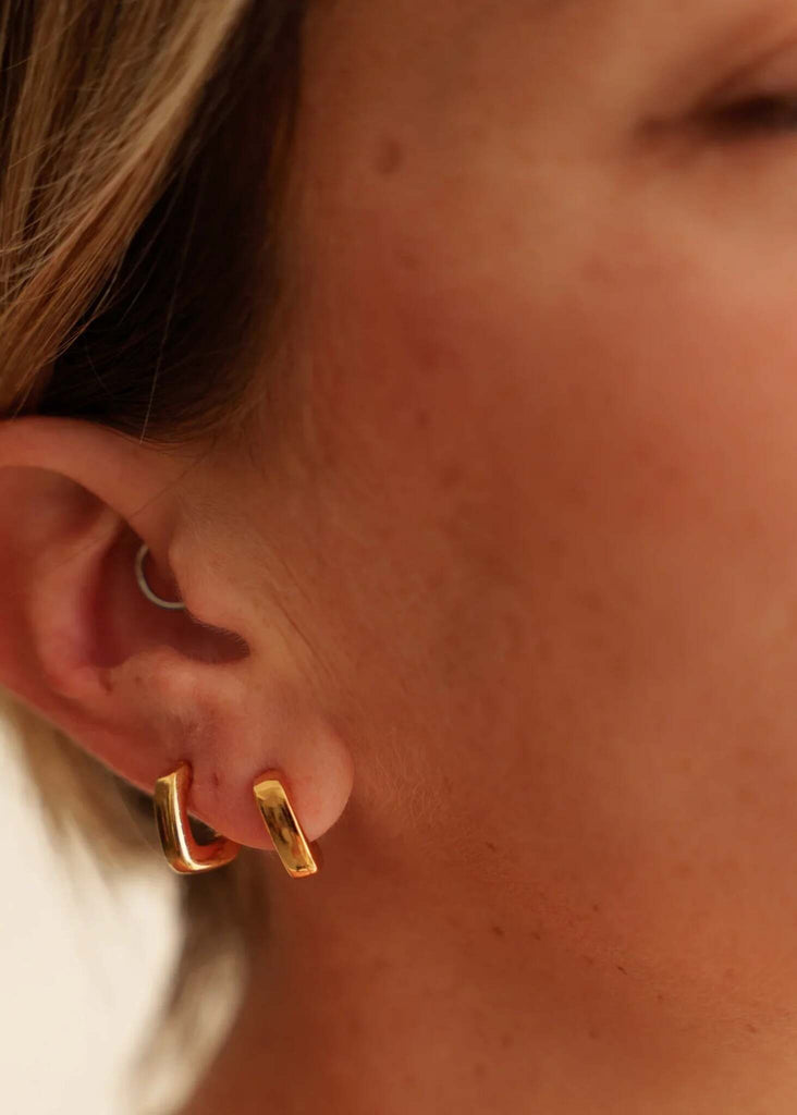 Persis Hoops — Detail of gold square hoops on model — MYFASHIONFRUIT