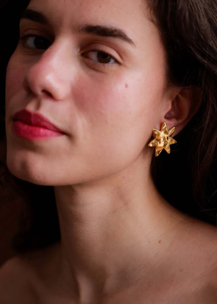 Raisa Earrings — gold star-shaped earrings on model — MYFASHIONFRUIT