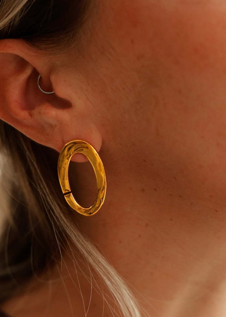 Kiah Earrings — Gold oval earring on model, detail — MYFASHIONFRUIT