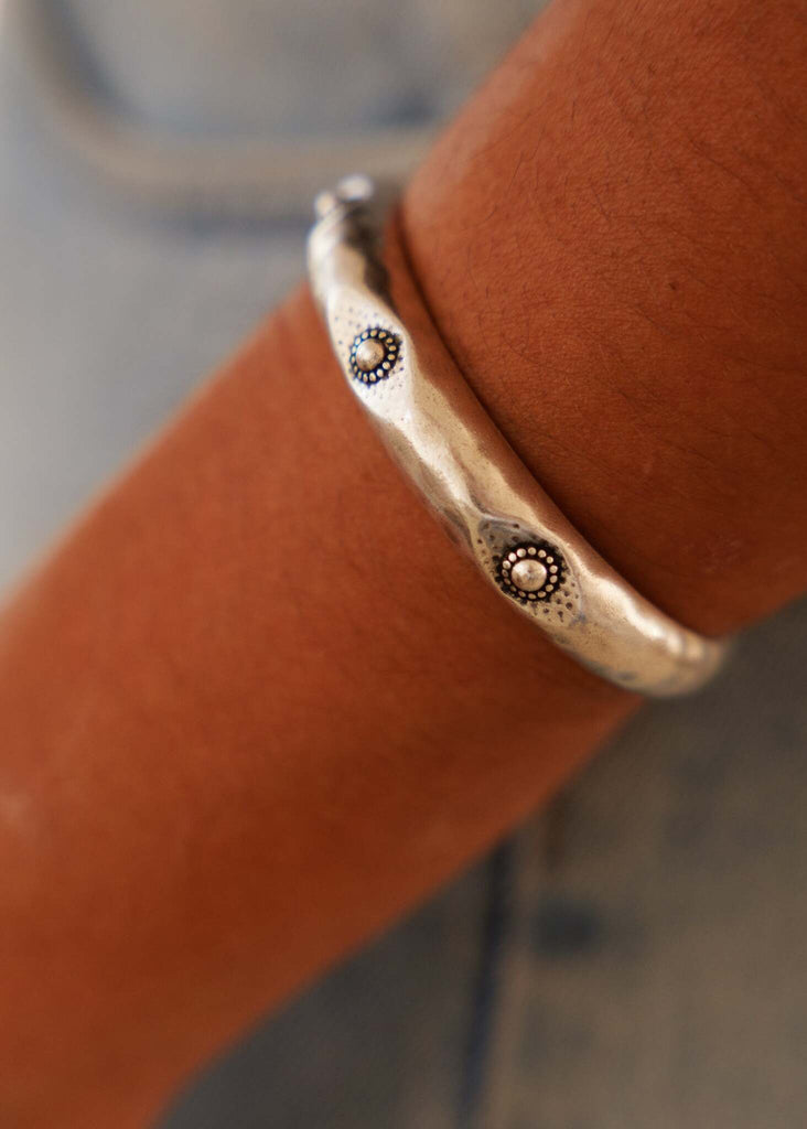 Woman wearing The Ultimate Bracelet Duo — antique silver hammered cuff with dots — MYFASHIONFRUIT