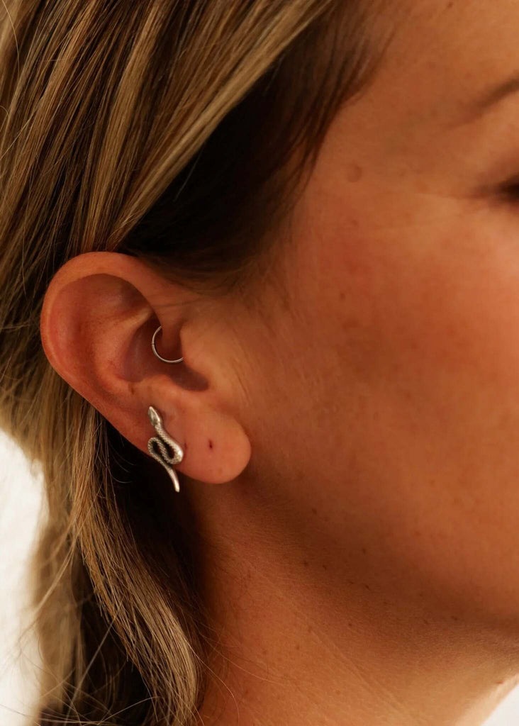 Nagini Earrings — Silver snake earring detail on model — MYFASHIONFRUIT