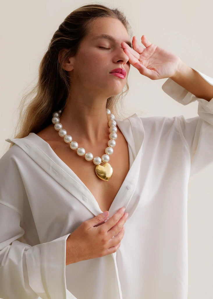 Jacqui Necklace — Pearl necklace with gold heart on model — MYFASHIONFRUIT