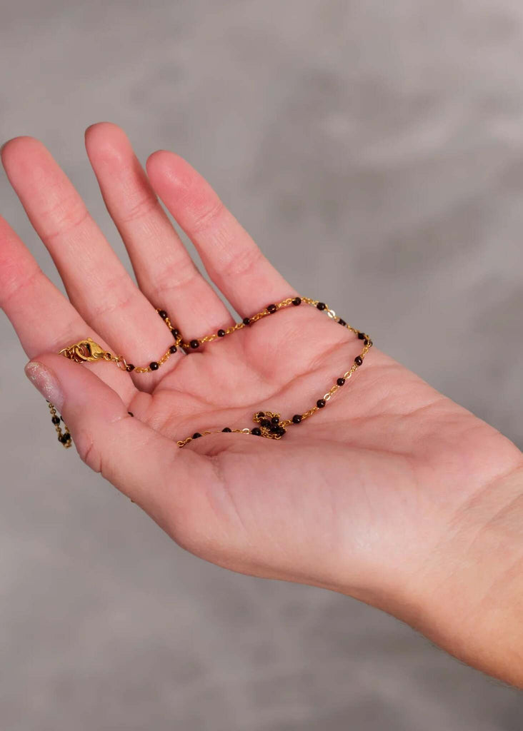 Dakota Necklace — Gold necklace with black beads on hand — MYFASHIONFRUIT