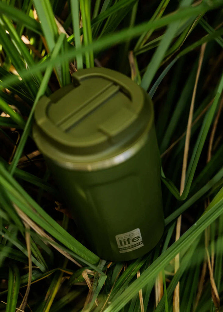 Ecolife Green Coffee Thermos — Green thermos in grass, detail — MYFASHIONFRUIT