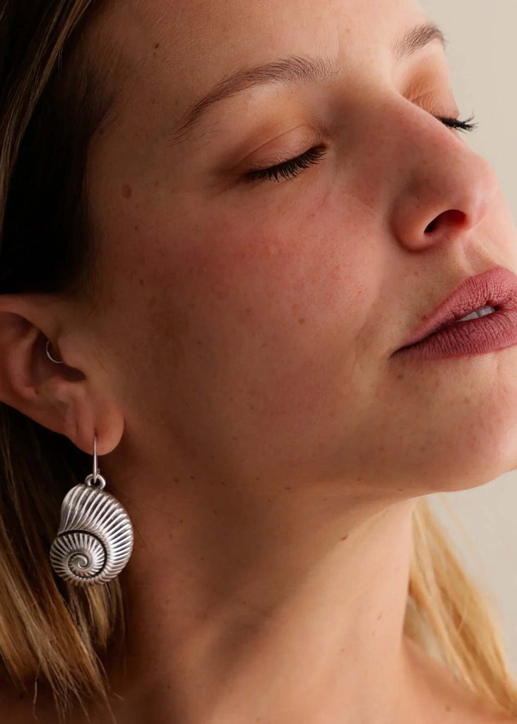 Pupu Earrings — Silver seashell earrings on model — MYFASHIONFRUIT