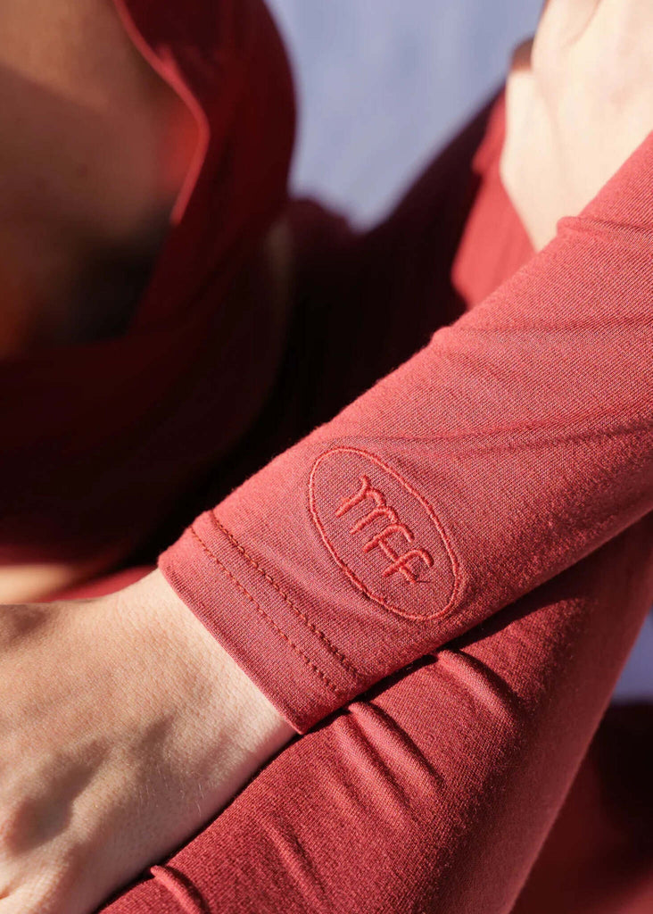 Lullaby Cardi — detail, terracotta knit on model, logo on sleeve — MYFASHIONFRUIT