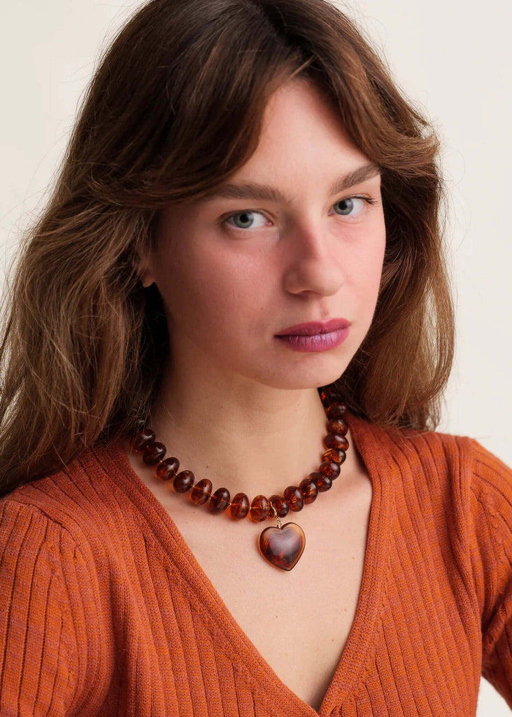 Moyo Necklace — brown beaded necklace with heart pendant on model — MYFASHIONFRUIT
