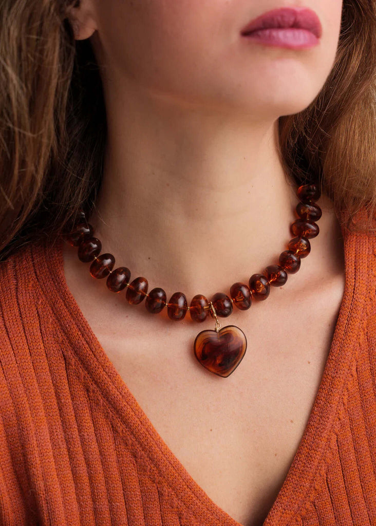 Moyo Necklace — brown beaded necklace with heart pendant on model — MYFASHIONFRUIT