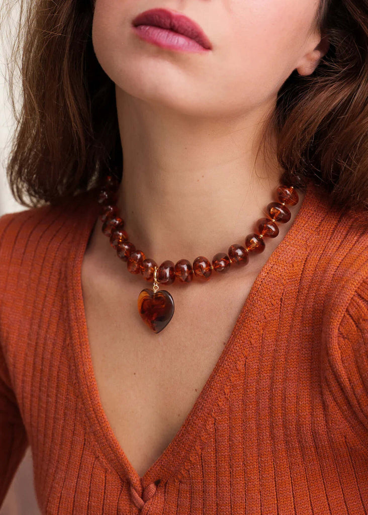 Moyo Necklace — Orange beaded necklace with heart on model — MYFASHIONFRUIT