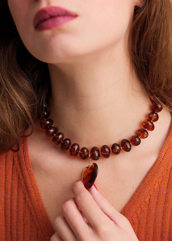 Moyo Necklace — Amber bead necklace with heart pendant on model — MYFASHIONFRUIT