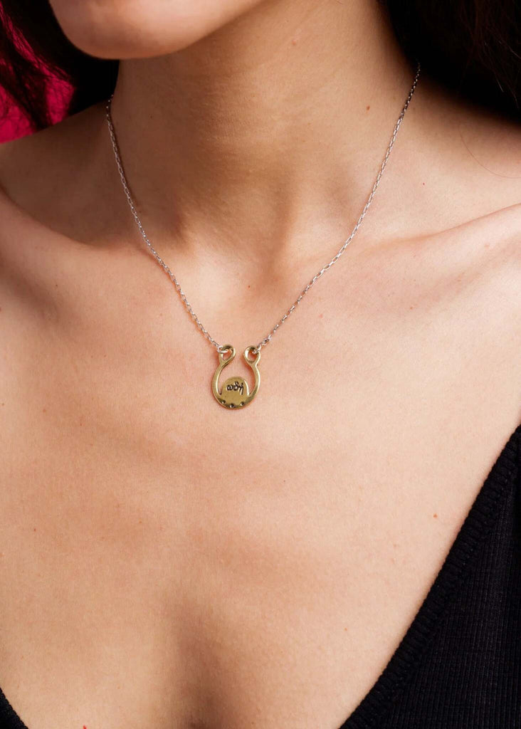 Ode to Joy 2024 Pendant — silver chain, gold pendant on model — MYFASHIONFRUIT