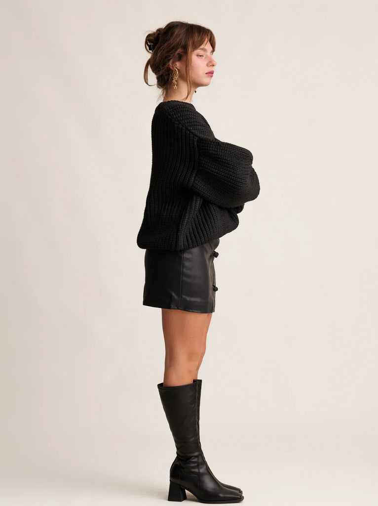 Cruella Skirt — Black faux leather mini on model — MYFASHIONFRUIT