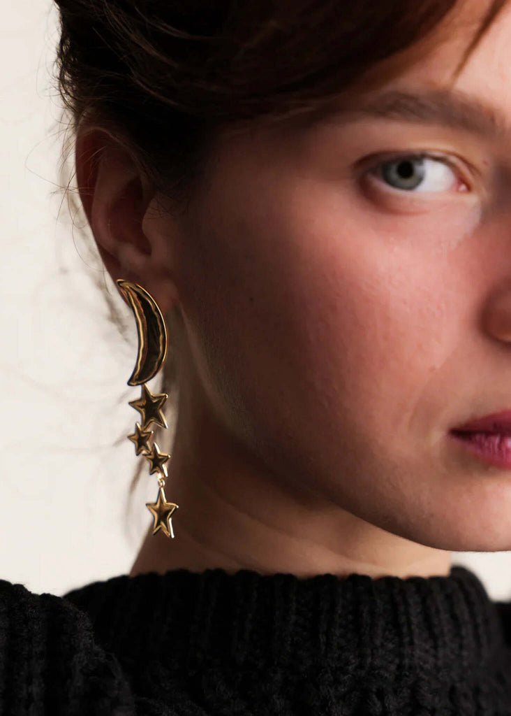 Cosmic Earrings — Gold moon and stars on model — MYFASHIONFRUIT