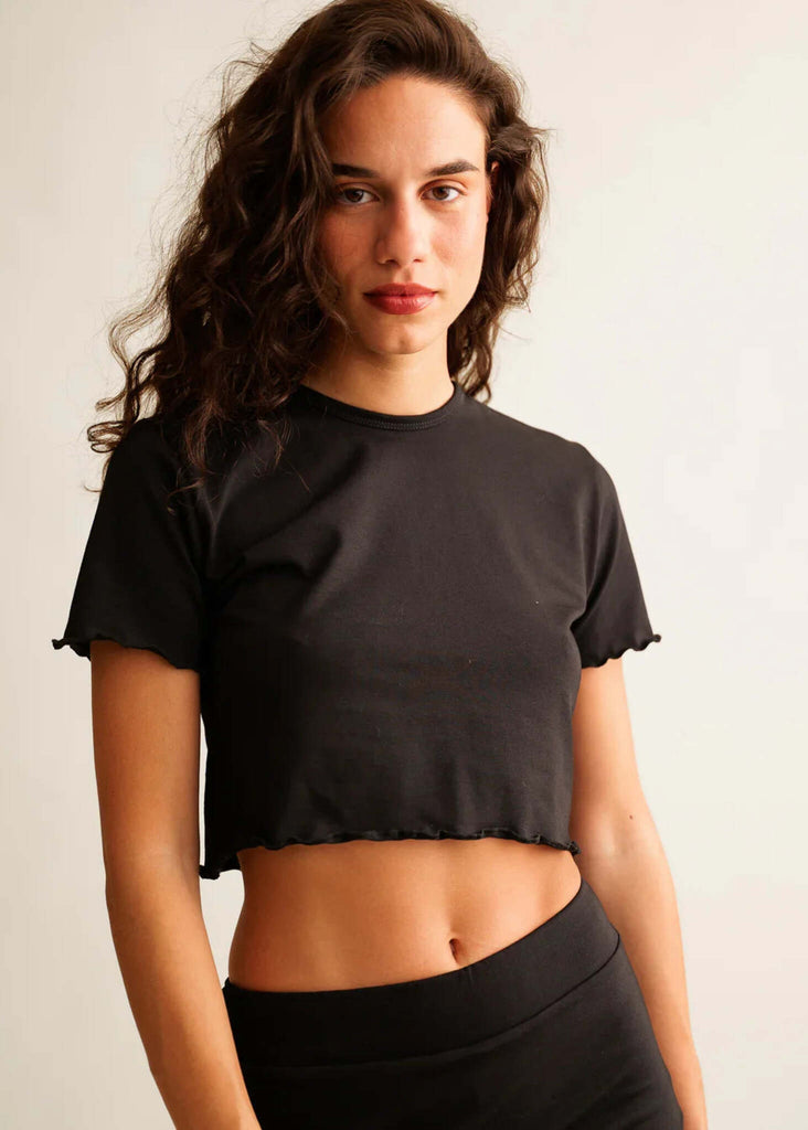 Rachel Baby Tee — Black crop top with lettuce hem on model — MYFASHIONFRUIT