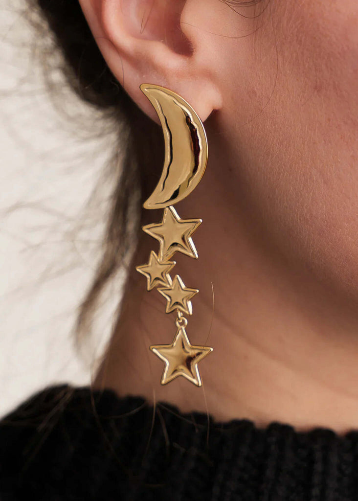 Cosmic Earrings — Gold moon and stars on model — MYFASHIONFRUIT