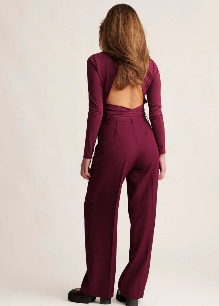 Michelle Trousers — Burgundy, wide-leg, on model from back — MYFASHIONFRUIT