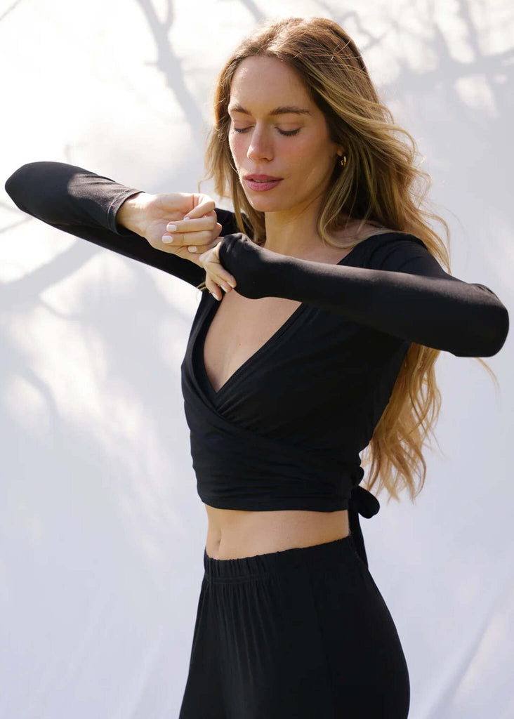 Lullaby Cardi — Black wrap top with thumb holes on model — MYFASHIONFRUIT