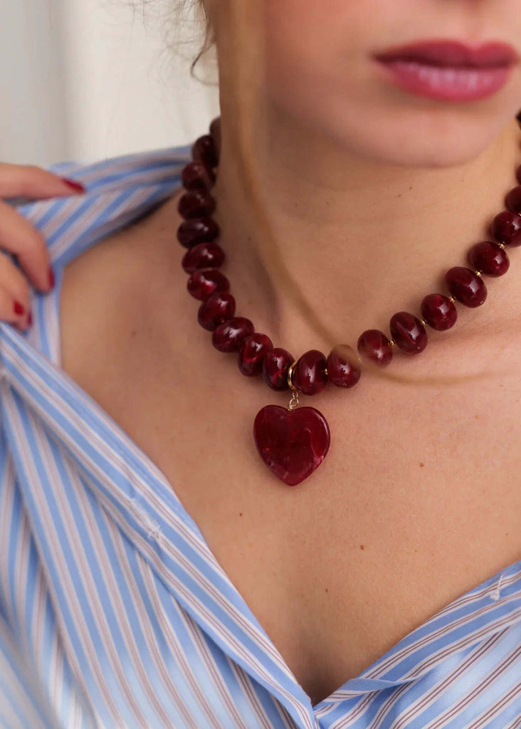 Moyo Necklace — Red beaded necklace with heart pendant on model — MYFASHIONFRUIT