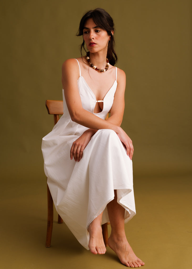 Erin Dress — White dress on model sitting — MYFASHIONFRUIT