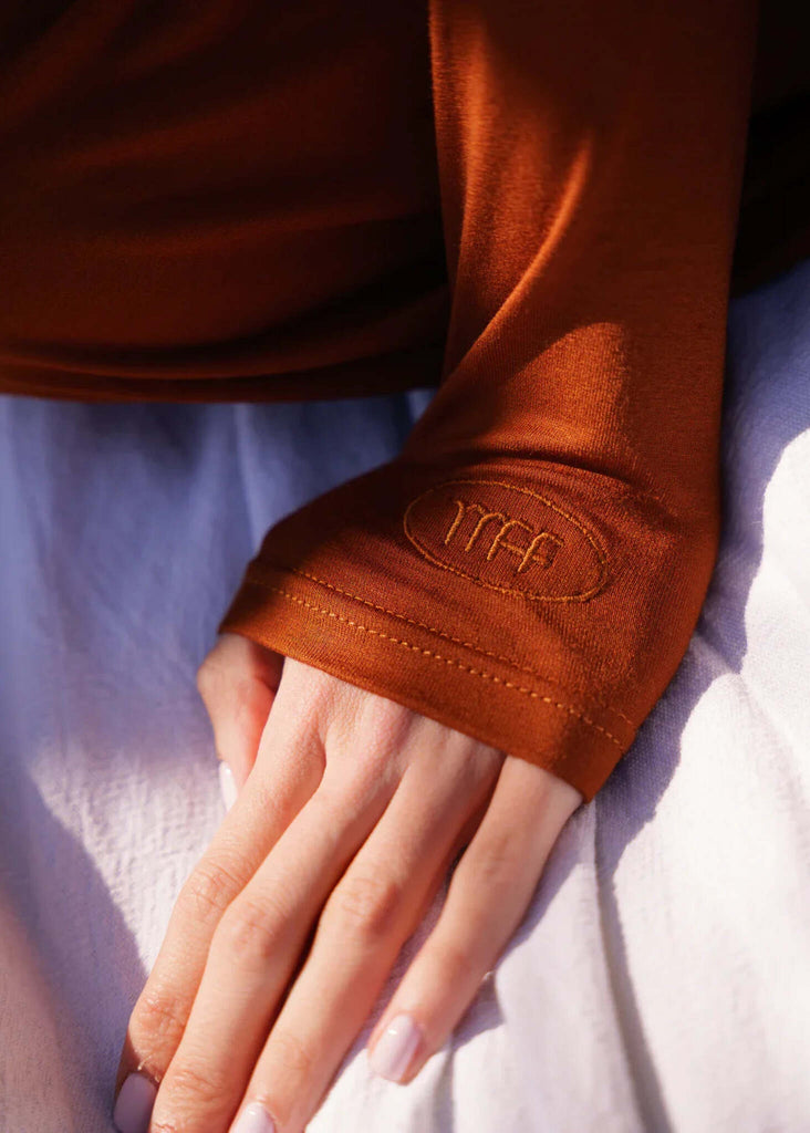 Lullaby Cardi — Detail of rust-colored sleeve, MFF logo — MYFASHIONFRUIT
