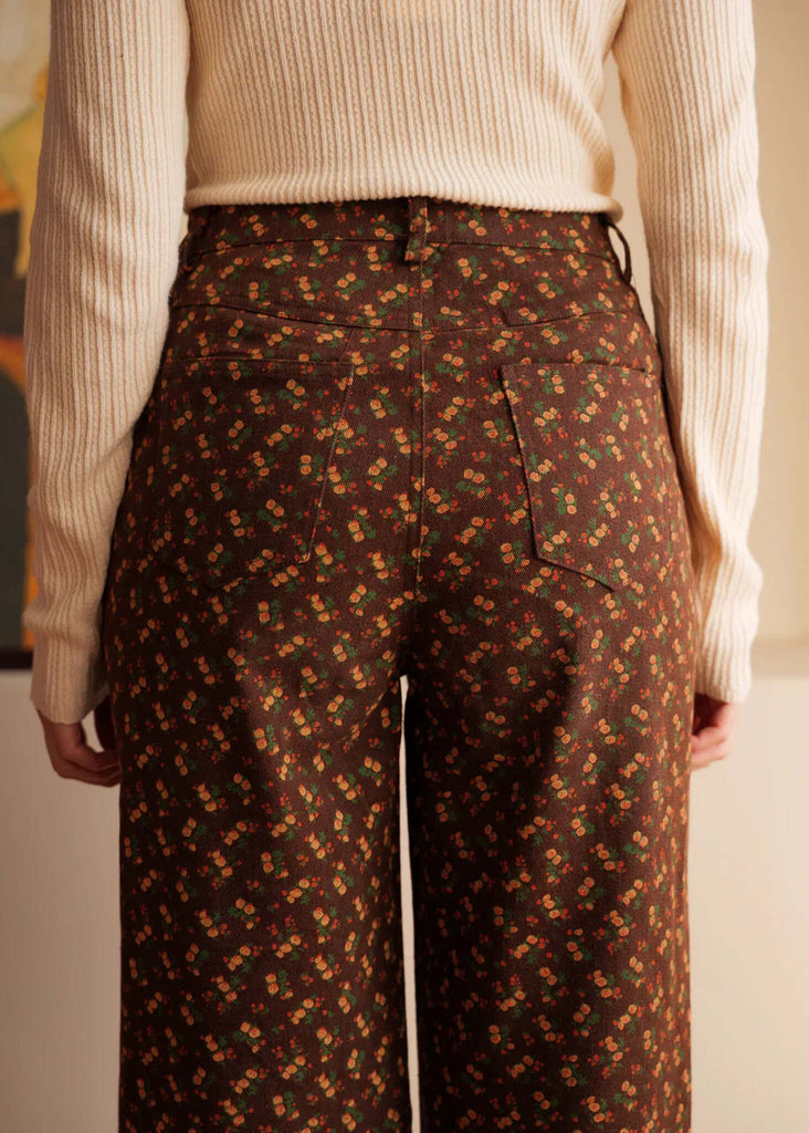 Cassia Jeans — Floral brown pants on model, rear view — MYFASHIONFRUIT