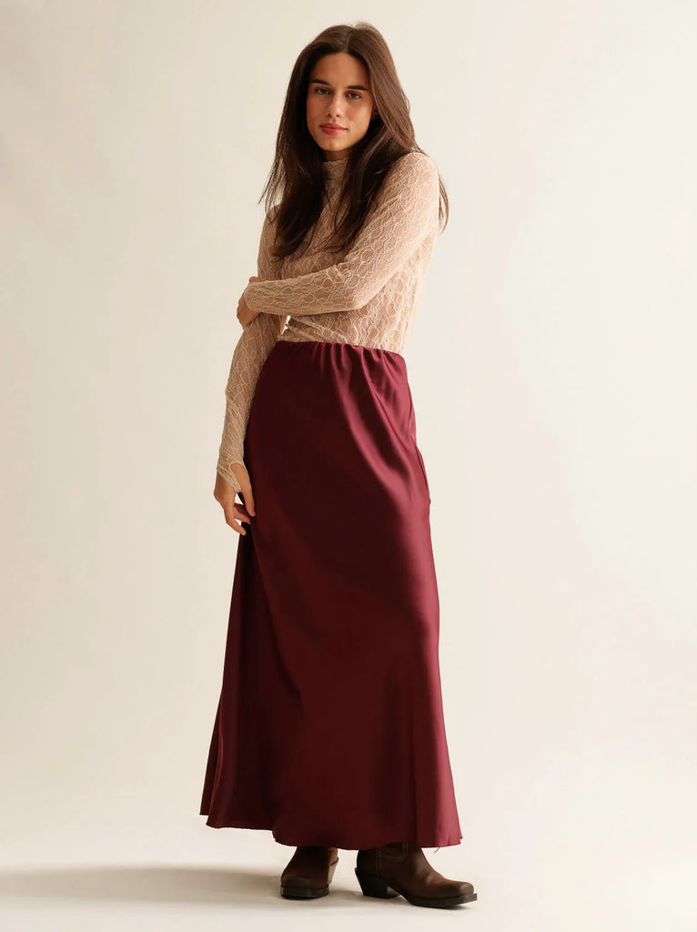 Keena Skirt — Burgundy satin midi skirt on model — MYFASHIONFRUIT