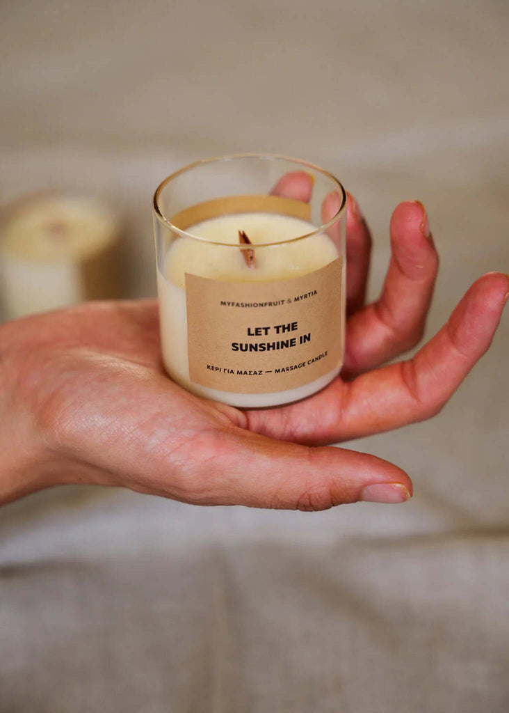 Massage Candle — Candle in glass jar in hand — MYFASHIONFRUIT